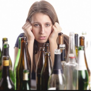 women with empty wine bottles
