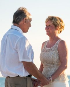 a photo of older couple holding hands wedding marriage family issues