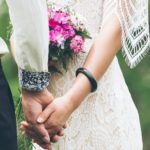 stock photo bride and groom holding hands