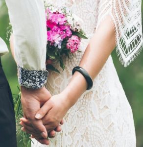 stock photo bride and groom holding hands